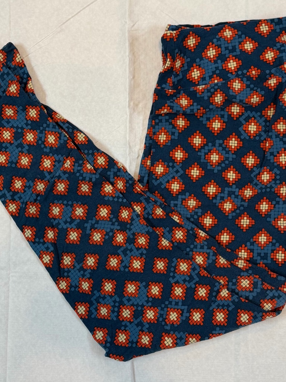 LuLaRoe Navy Leggings with Orange Geometric Print, TC